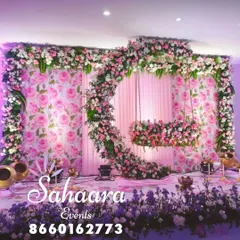 For a truly special naming ceremony or baby shower, we designed this breathtaking floral swing. The crescent moon shape, covered in soft pink and white flowers against a rose-patterned backdrop, creates a magical setting to welcome your little one.