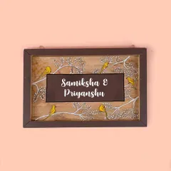 This custom nameplate features little yellow birds perched on white branches. It’s a cheerful and charming design that we created to reflect a client's love for nature.