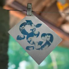 An abstract cyanotype made with flowers and leaves by one of the children at Garike. They quickly took over the process, turning it into their own joyful exploration.