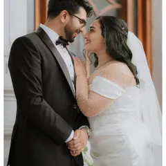 An intimate portrait of the bride and groom, their happy smiles reflecting the love and commitment shared on their wedding day. These are the quiet moments that hold so much meaning.