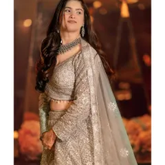 A portrait of pure elegance. The bride looks away from the camera, giving the shot a candid and timeless feel.