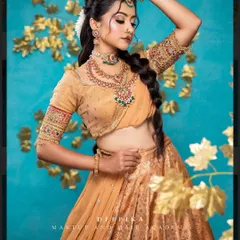 I love this elegant half saree look. The mustard gold skirt is paired with a simple blouse and a sheer dupatta, creating a sophisticated style for any pre-wedding event.
