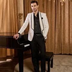 A timeless white tuxedo jacket with contrasting black shawl lapels, offering a sharp and sophisticated look for any cocktail party or reception. This bespoke piece is tailored for a clean silhouette that commands attention with quiet confidence.