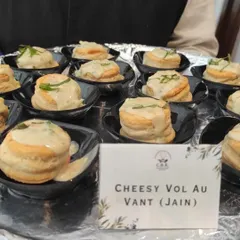 A closer look at our Jain Cheesy Vol Au Vants. These delicate, flaky puff pastries are filled with a rich, creamy cheese sauce, all prepared according to strict Jain dietary guidelines.