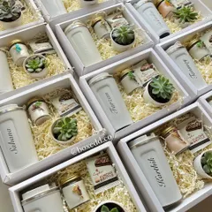 Personalized Yoga Day gift sets featuring custom-named tumblers, succulents, and scented candles. These calming gifts are perfect for setting a meditative mood at workplace yoga sessions.
