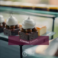 A close-up of a decadent brownie topped with caramel and meringue. Our gourmet artistry extends to our dessert menu, where we create sweet treats that are both indulgent and beautiful.