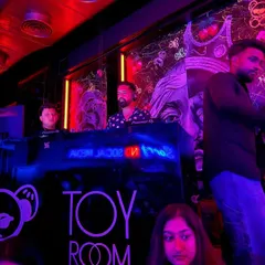Behind the decks at Toy Room, one of my regular spots. The lighting, the sound system, the crowd, it all comes together for a perfect club night.
