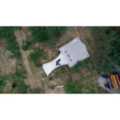 The 'Before' shot of a property. This aerial image documents the initial state of the land before the landscaping and construction work began.