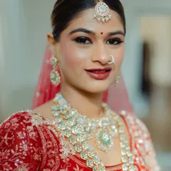 A close-up of the flawless makeup on my bride Mansi. Notice the clean lines of the eyeliner and the soft contour that enhances her features without looking heavy, a key part of my bridal makeup philosophy.