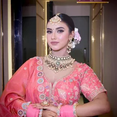 This stunning bridal portrait, featuring a classic updo and intricate jewelry, is the result of the professional training our students receive. Learn to create timeless beauty.