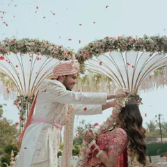 The pure joy of the Varmala ceremony. I focus on capturing the energy, the shower of petals, and the genuine smiles that make this tradition so special. This is a classic Indian wedding moment, frozen in time.