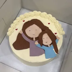 A sweet, simple drawing of a mother and daughter, making this cake a heartfelt gift. We love creating these personal illustrations that tell your family's story.