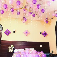 I can work with any color combination to match your style. This bedroom decoration uses a lovely mix of purple, pink, and silver balloons on the ceiling and bed, with simple balloon flower accents on the wall.