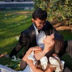 A moment of pure, uninhibited laughter between the couple as they relax on the grass. Capturing these genuine emotions is what makes a pre-wedding shoot so special.