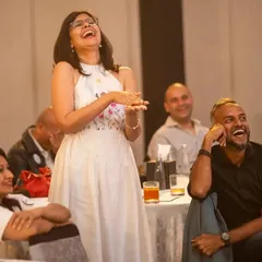 A guest erupts in laughter during a performance. It's not just about amazement, it's about creating a fun and memorable experience.