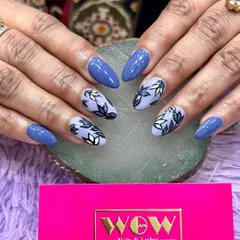 A beautiful floral design on a deep blue base. The hand-painted leaves in shades of blue and white create a sophisticated and artistic look.