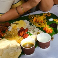 A proper Sadhya is a feast for the eyes and the palate. This is a close-up of the spread, with all the essential dishes like avial, thoran, pachadi, sambar, and pappadam, ready to be enjoyed.