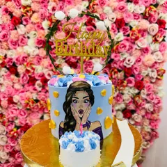 The trending "blow-up" cake. A smaller mini-cake is placed in front of a larger cake, creating a fun visual illusion that's perfect for photos.