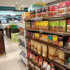 You can find my brown paper packets of homemade goodness alongside other quality products at Food Hall. It's a joy to see my kitchen's offerings reaching a wider audience.