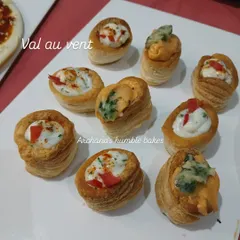 These are my vol-au-vents, which are small, hollow cases of puff pastry. I fill them with a variety of creamy vegetable and cheese fillings, making them a perfect bite-sized appetizer for parties.