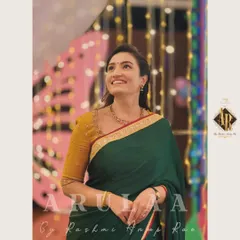 A classic combination for actress Vaishnavi Gowda. I designed this simple yet elegant mustard yellow blouse with a unique neckline to pair with her dark green saree. It's a timeless look perfect for any festive occasion.