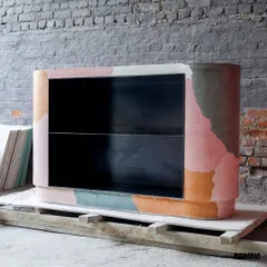 Our custom-made multi-color bar table, featuring a unique leaf imprint on the side. This piece combines playful color blocking with subtle natural texture, creating a functional bar that is also a piece of art.