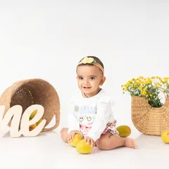 A mango themed one year milestone session. Incorporating your baby's favorite fruits or toys is a great way to ensure they have fun and give us those precious, natural smiles.