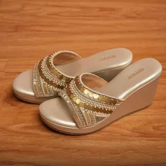 Get the height and the comfort with my Ariel Gold Vegan Wedge Heels. The platform wedge is perfect for outdoor events, and the sequined strap adds just the right amount of sparkle to your look.