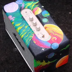 A top-down view of the custom Marshall speaker. The galaxy and planet design is super colorful and even glows in the dark for those late-night karaoke sessions.