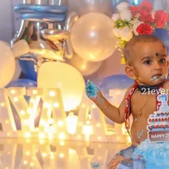 Another adorable cake smash photo. The background decor ensures even these messy moments look great in pictures.