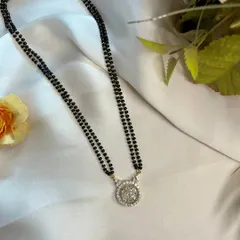 This mangalsutra is a cherished symbol of love and commitment. The stunning round diamond pendant creates a design that is equal parts timeless and modern, perfect for elevating your everyday look.