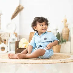 A bright, happy smile from a two-year-old. We know how to engage with toddlers to bring out their best and most natural expressions.