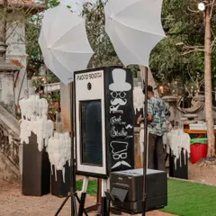 A classic photo booth with a fun, quirky design. Interactive stations like this are a great way to ensure guests have a blast and capture memories that last a lifetime.
