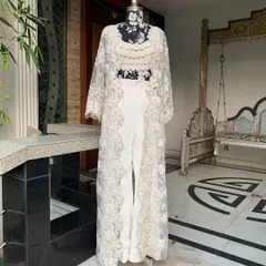 The full view of our white lace jacket set. The straight-fit pants and long jacket create a very chic and elongated silhouette.