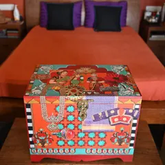 My custom memory boxes are designed to hold your most precious keepsakes. This piece, crafted from salvaged teak, uses decoupage and hand-painting to weave together themes of colonial-era portraiture and traditional Indian jewelry, making it a personal treasure chest.