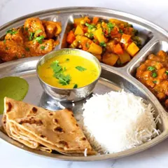 This traditional Indian thali may look balanced, but it's loaded with carbohydrates and lacks sufficient protein. This kind of meal can spike your sugar levels and lead to weight gain. I teach you how to build a better plate.