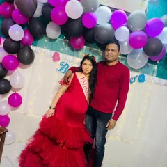 Celebrate your baby shower in style with this gorgeous, tiered red tulle gown. It’s vibrant, comfortable, and photographs beautifully, making it the perfect outfit for your special celebration. This happy client looks absolutely radiant!