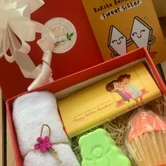 Another variation of my customizable Rakhi gift box. This one includes a cute green bear soap and a cupcake soap, paired with a towel, chocolate, and a 'Sweet Sister' card.