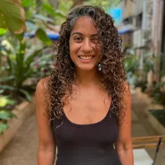A happy client with her freshly defined curls. The non-bleach color adds richness without compromising curl health. (No filter)