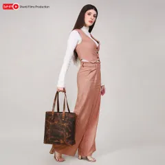 This lifestyle photograph for a leather tote bag shows how we place products in a fashion context. We focus on creating a complete look that helps customers visualize themselves using the product.