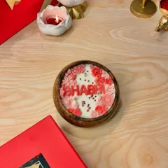 The "Bhabhi" candle, with its pink and red floral details, is designed to celebrate the special bond you share. It's a beautiful way to say you care.
