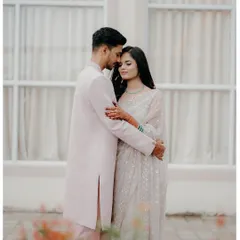 A quiet, tender embrace. Dressed in elegant attire, this portrait focuses on their emotional connection and the peaceful comfort they find in each other.