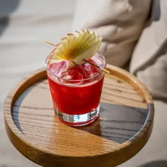 This shot of a vibrant red cocktail demonstrates my skill in beverage photography. I use light and shadow to create a moody, sophisticated feel that makes the drink the hero, perfect for a bar's menu or social media.