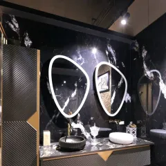 This vanity design for the Fima showroom is a statement in modern luxury. I contrasted dramatic black marble walls with custom back-lit asymmetric mirrors and gold fixtures to create a high-impact display that showcases the product in a bold, aspirational setting.