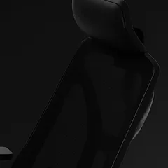 A detailed look at the breathable mesh back and adjustable headrest. This design allows for air circulation to keep you cool while providing essential support for your neck and upper back.