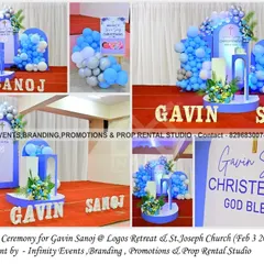 A heavenly christening ceremony for baby Gavin. The decor features a serene blue and white color palette, modern arch backdrops, and elegant floral accents, creating a peaceful and blessed atmosphere.