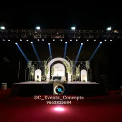 For a truly dramatic effect, we use professional truss lighting to frame the stage. This setup highlights the clean, elegant decor while adding a concert-like feel to the wedding reception.