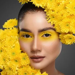 For editorial and creative shoots, I love incorporating natural elements. In this beauty portrait, we built the concept around these vibrant yellow flowers, matching them with bold yellow eyeshadow for a cohesive and visually arresting image. This is a great example of a conceptual beauty shoot.