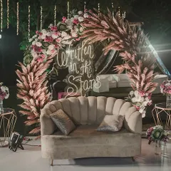 This boho-chic Sangeet seating area was a favorite. I used a plush scalloped sofa, pampas grass, and a custom neon sign to create a cozy and incredibly photogenic corner.