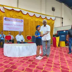 A proud moment as Ghanavi receives her award at the Karnataka State Ranking Table Tennis Tournament. This is a significant milestone in her competitive journey.
